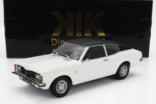 Coche modelo Ford Taunus GT blanco con techo negro delante de una caja Scale K negra y dorada, disponible en Vroomi.