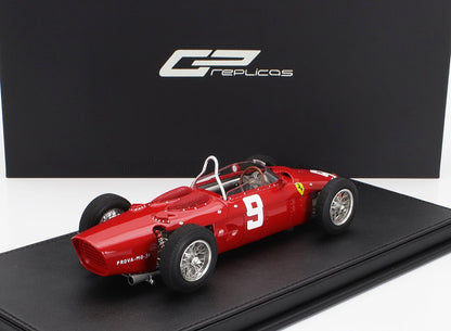 Red vintage Ferrari race car model number 9 displayed on black base, offered on Vroomi
