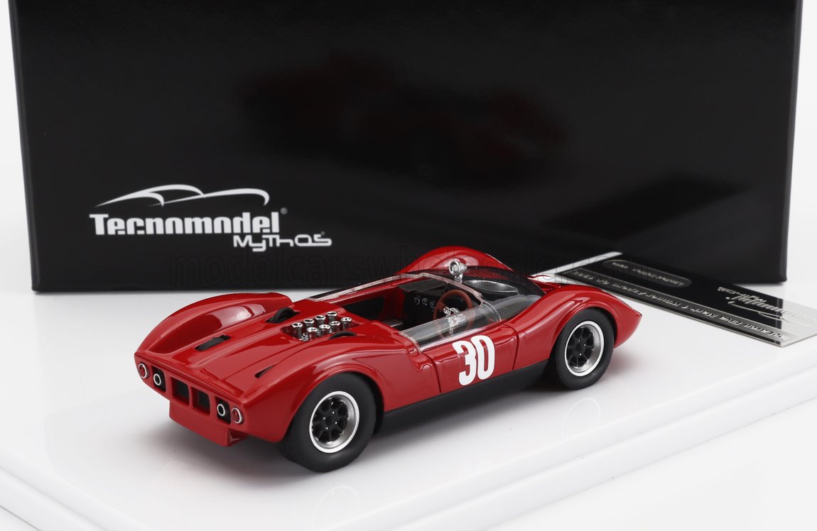 Modelo clásico de coche de carreras Red Tecnomodel 30 sobre soporte blanco, disponible en la plataforma Vroomi.