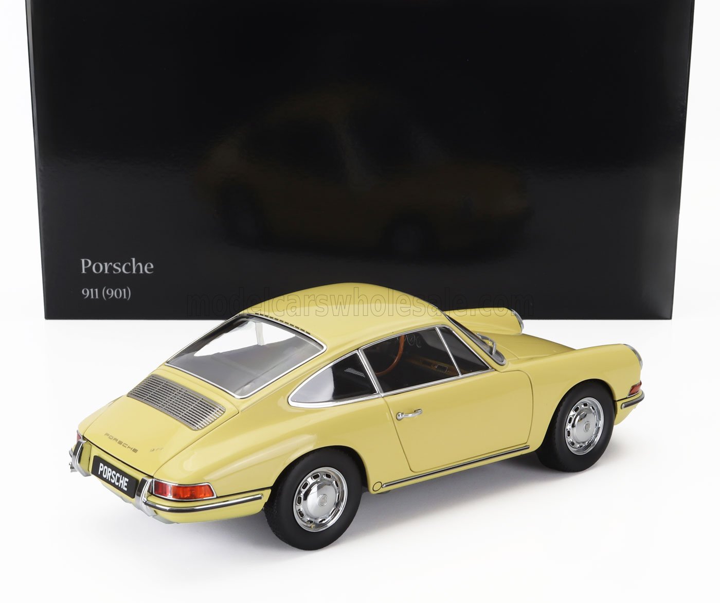 Yellow Porsche 911 901 model car displayed with black backdrop, now offered on Vroomi platform