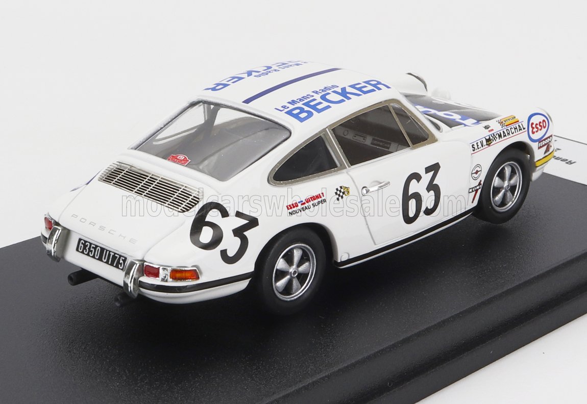 Modelo de coche de carreras Porsche 911 blanco con el número 63 y pegatinas vintage de patrocinadores, ahora en Vroomi.