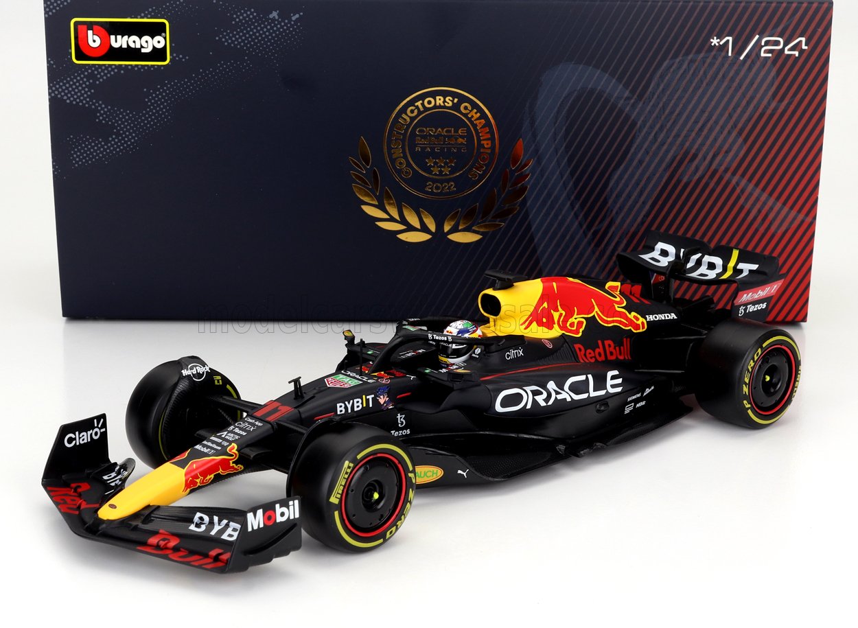 Modelo de coche de carreras Red Bull F1 a escala 1/24 con marcas detalladas y neumáticos blandos, disponible en Vroomi.