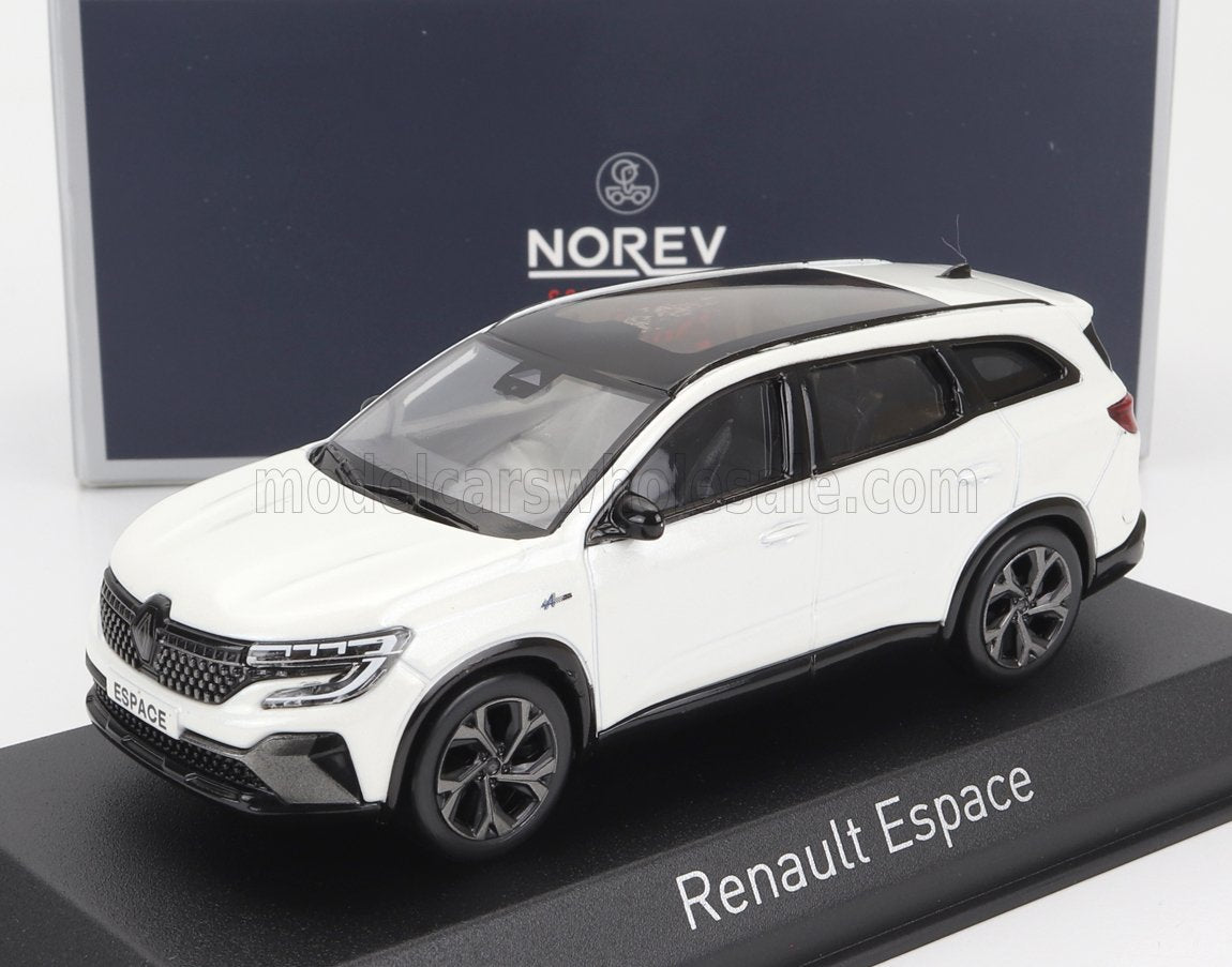 Modelo de coche Renault Espace blanco con techo negro y parrilla detallada en soporte de exposición, disponible en Vroomi.