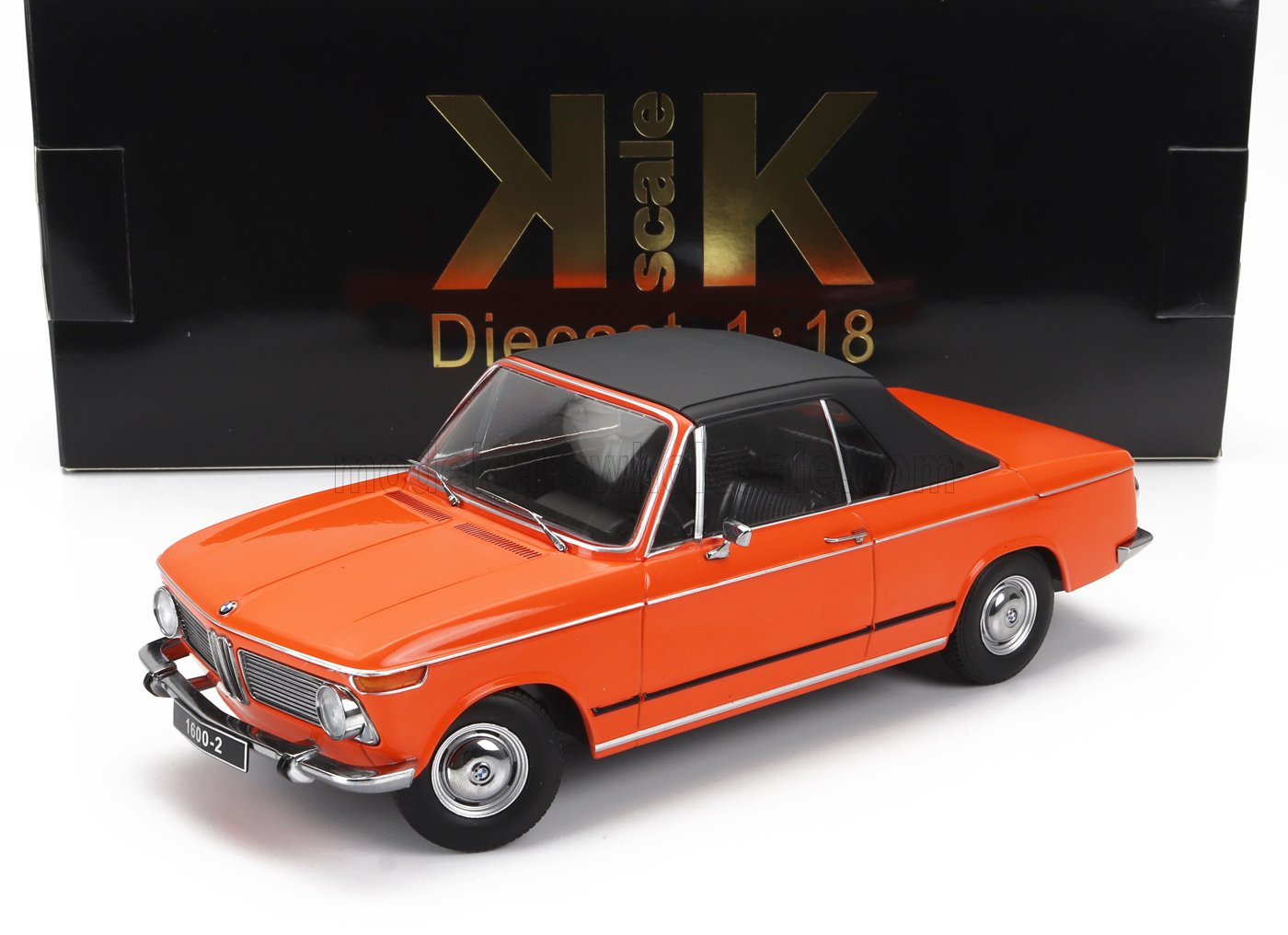 Coche de juguete BMW naranja a escala 1:18 con techo negro, disponible en Vroomi.