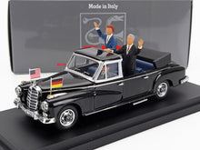 Black vintage convertible model car with American and German flags, two figures waving, available on Vroomi