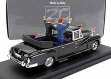 1:43 scale black vintage Mercedes 300 model car with two waving figures, flags of Germany and USA, sold on Vroomi