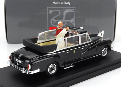 Black Mercedes-Benz 300 model Pope mobile with figure in white and red papal robes on display, sold via Vroomi