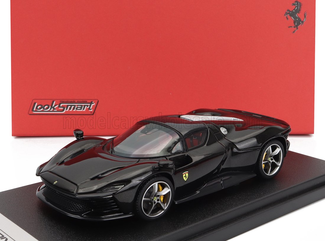 Black Ferrari model car by LookSmart on display with red Ferrari backdrop, available on Vroomi