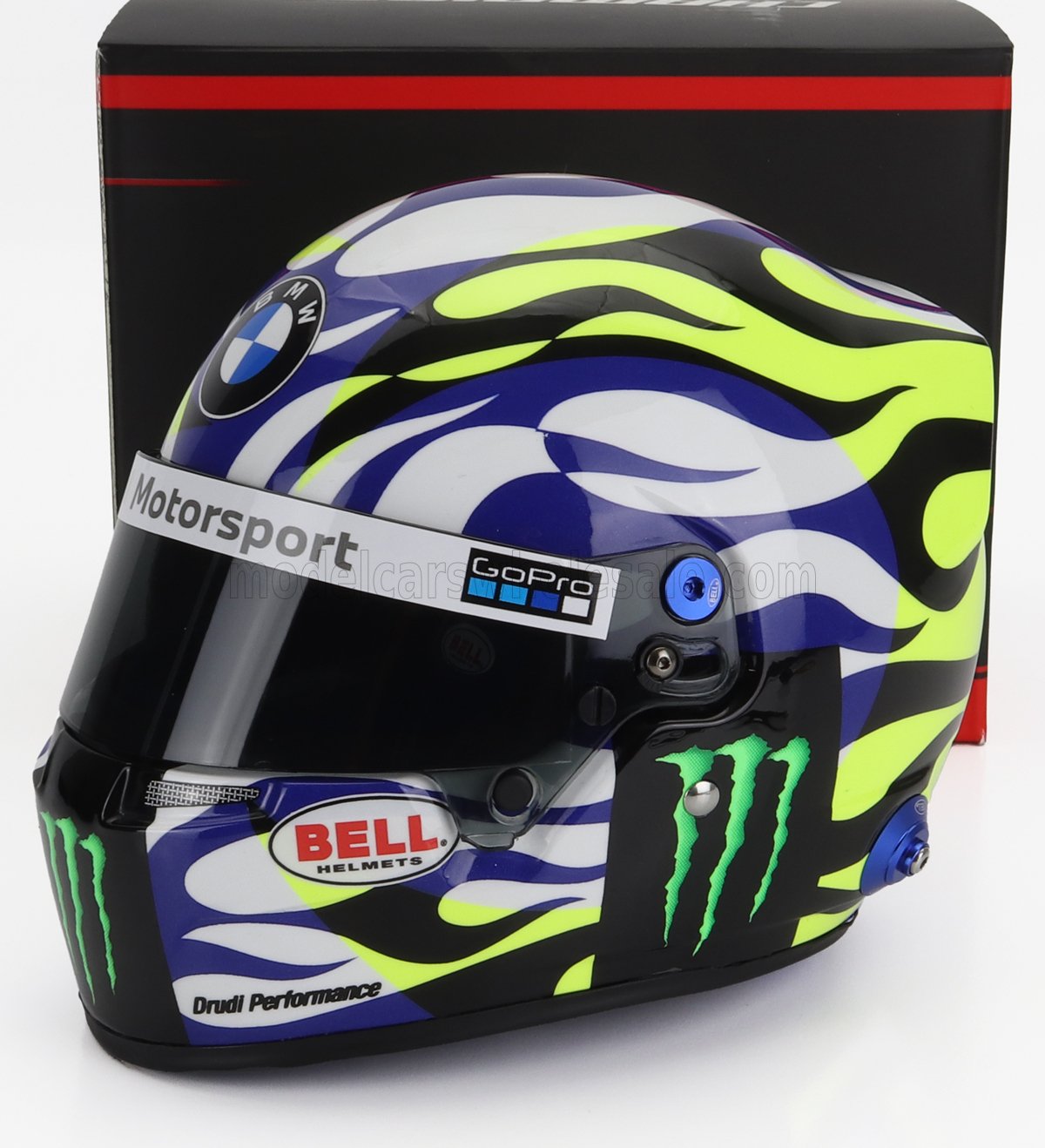 Casco de carreras BMW Motorsport con diseño en verde neón, negro y azul, logotipos Bell Monster, disponible en Vroomi.