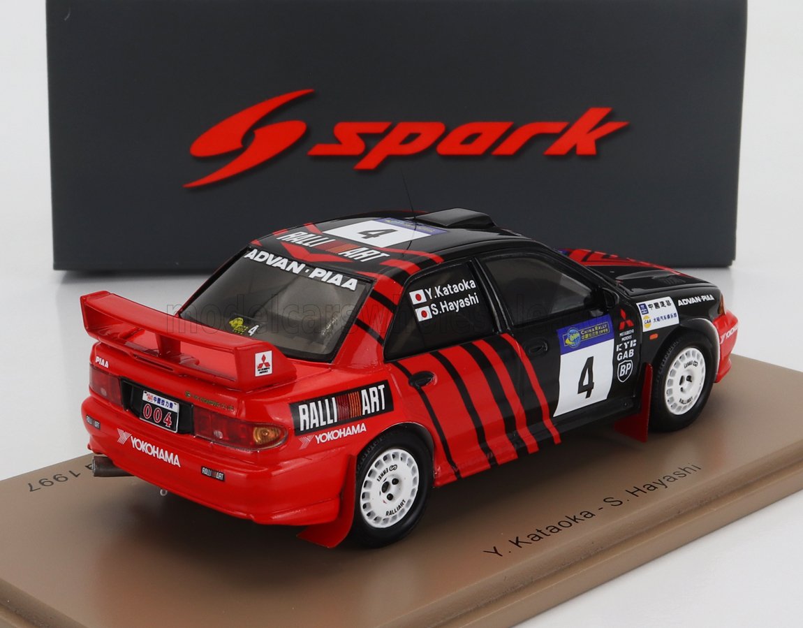 Red and black Mitsubishi Lancer Evolution rally car model with Ralliart and Yokohama decals, showcased with Spark branding, available on Vroomi