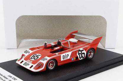Red Lola T292 race car model with number 65 on black display stand available on Vroomi