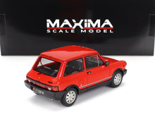 Maqueta de coche Abarth rojo con ribetes negros, expuesta delante de la caja Maxima Model, disponible en Vroomi.