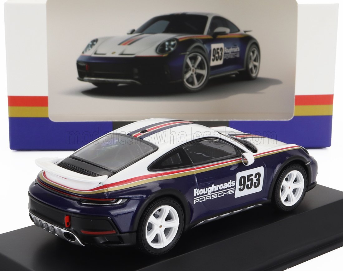 Coche de carreras Porsche 953 a escala, con diseño Roughroads en azul y blanco, disponible en Vroomi.