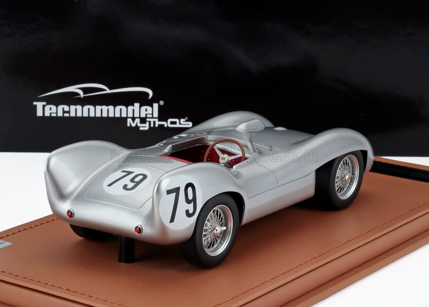 Silver vintage race car model number 79 on leather base, featured by Tecnomodel Mythos, also offered on Vroomi