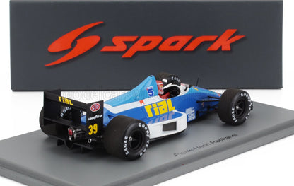 Coche de carreras Rial F1 a escala 1:43, azul y blanco, con logotipos de STP y Goodyear, Pierre-Henri Raphanel, disponible en Vroomi.