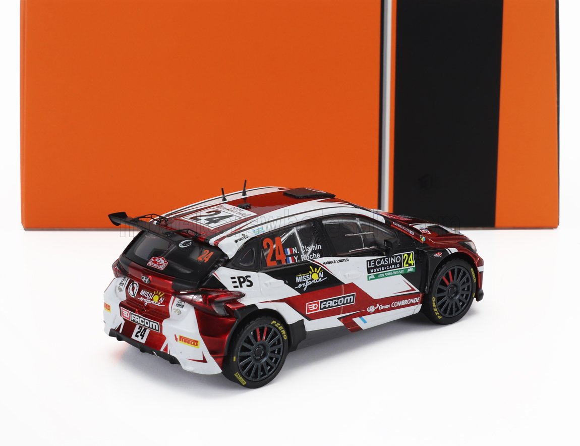 Modelo detallado de coche de rally a escala 1/18 en rojo y blanco, ya disponible en Vroomi.
