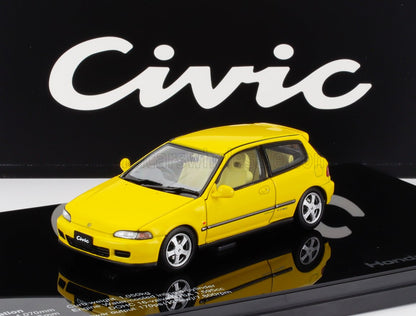 Yellow Honda Civic model car displayed on black platform with Civic logo, featured on Vroomi