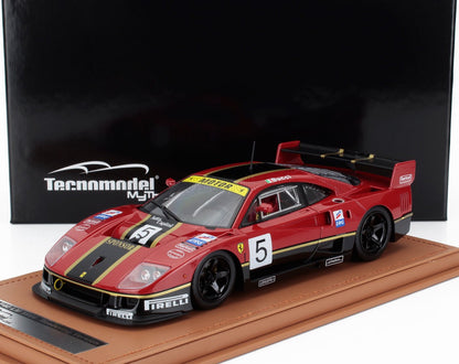Red Ferrari F40 LM 1996 race car model with black and gold stripes on leather base, available on Vroomi