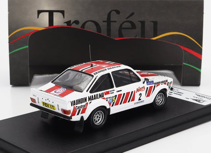 White Ford Escort rally car model with red racing stripes and sponsor decals on display, offered on Vroomi