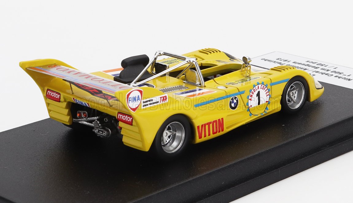 Yellow vintage race car model with sponsor decals on black display base available on Vroomi