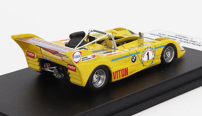 Yellow vintage race car model with sponsor decals on black display base available on Vroomi