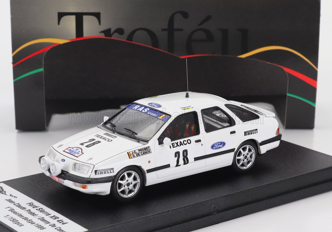 White Ford Sierra XR 4x4 rally car model with Texaco and Pirelli decals, on display stand available on Vroomi