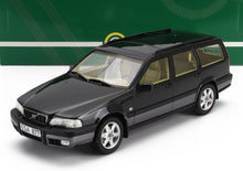 Coche Volvo familiar negro a escala 1:18 con interior marrón claro, réplica de coleccionista, ya disponible.