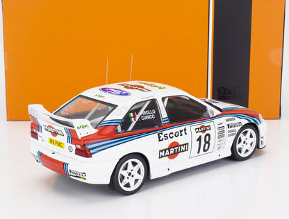 Modelo a escala 1:18 del coche de carreras Ford Escort, con decoración Martini y calcomanías detalladas, disponible en Vroomi.