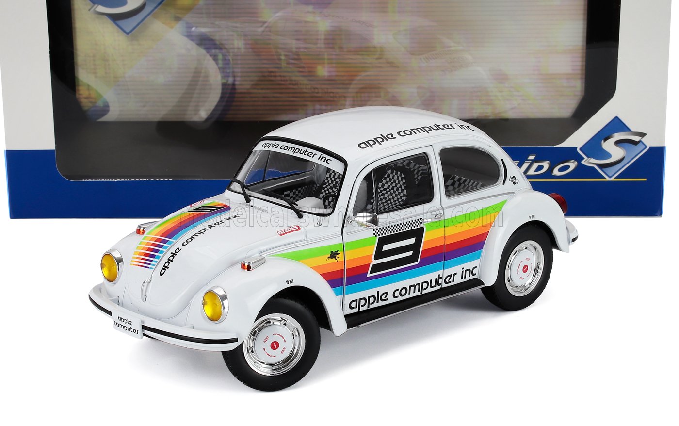 Modelo Volkswagen Beetle blanco con rayas arcoíris de Apple Computer Inc y el número 9, disponible en Vroomi.