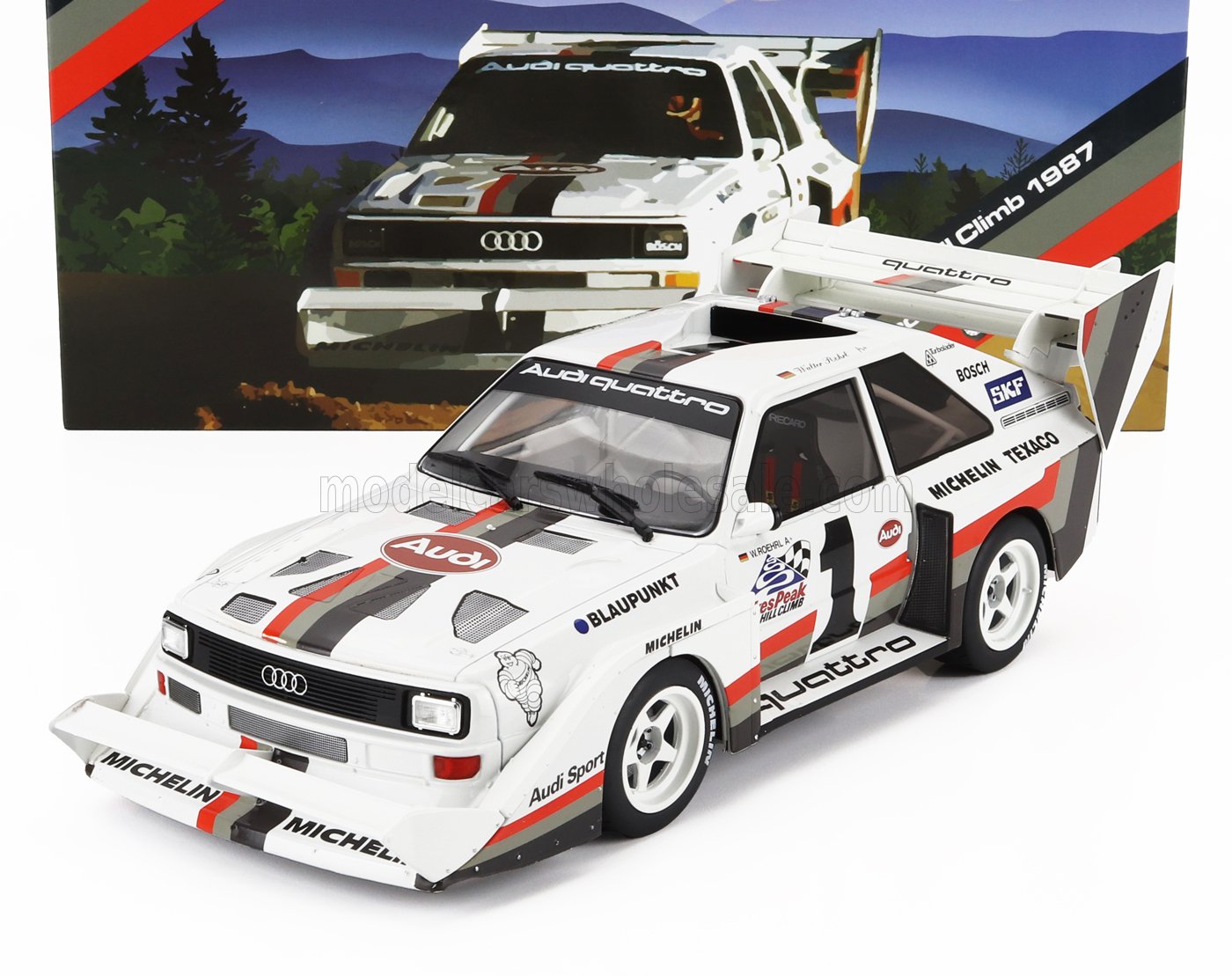 Coche a escala 1/18 Audi Quattro Pikes Peak 1987 con decoración de competición, disponible en Vroomi.