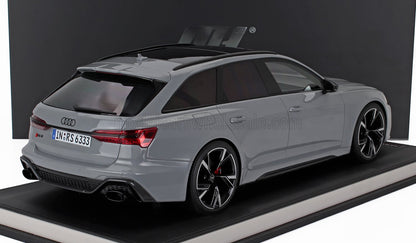 Modelo de coche Audi RS6 Avant gris con llantas negras y cristales tintados, disponible en la plataforma Vroomi.