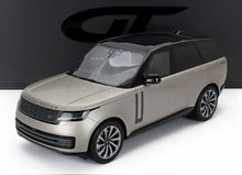 1/18 scale model of silver Range Rover SUV with black roof, realistic die-cast detail available at Vroomi