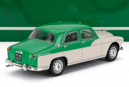 Maqueta en verde y crema de un coche clásico, réplica coleccionable fabricada en metal fundido, ya disponible online.