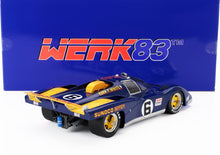 Coche de carreras a escala Blue Sunoco Ferrari n.º 6 con ruedas doradas, actualmente disponible en línea.