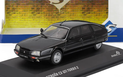Modelo Citroën CX GTI Turbo 2 negro en expositor, disponible a través de Vroomi.