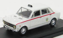 Modelo de taxi vintage blanco con franja roja y letrero de taxi en el techo, disponible en Vroomi.