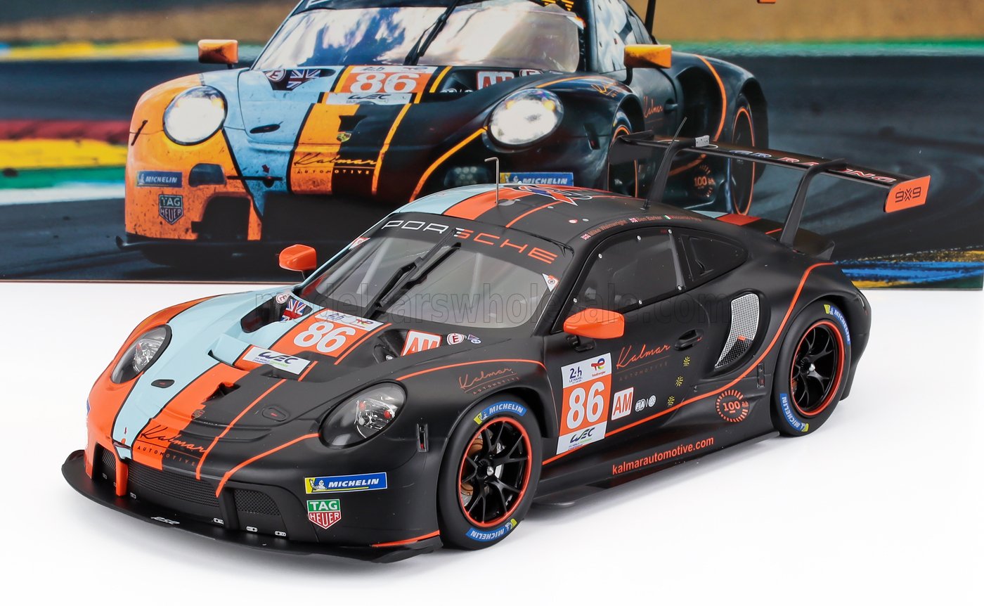 Porsche 911 GT3 R race car model in black and orange with number 86, available on Vroomi