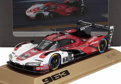 Detailed model of Porsche 963 race car in red, white, and black on display stand, featured on Vroomi