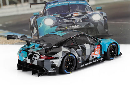 1/18 scale Porsche 911 RSR model racing car with camouflage livery, available now on Vroomi