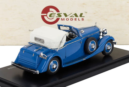 Coche de juguete descapotable vintage azul con capota blanda blanca sobre una base negra, disponible en Vroomi.