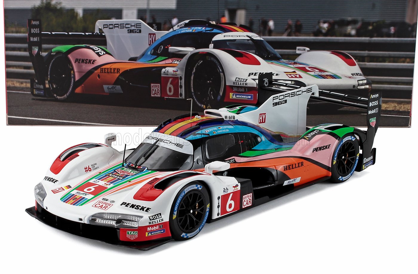 Porsche 963 No. 6 race car scale model with multicolor livery, collectible now available online
