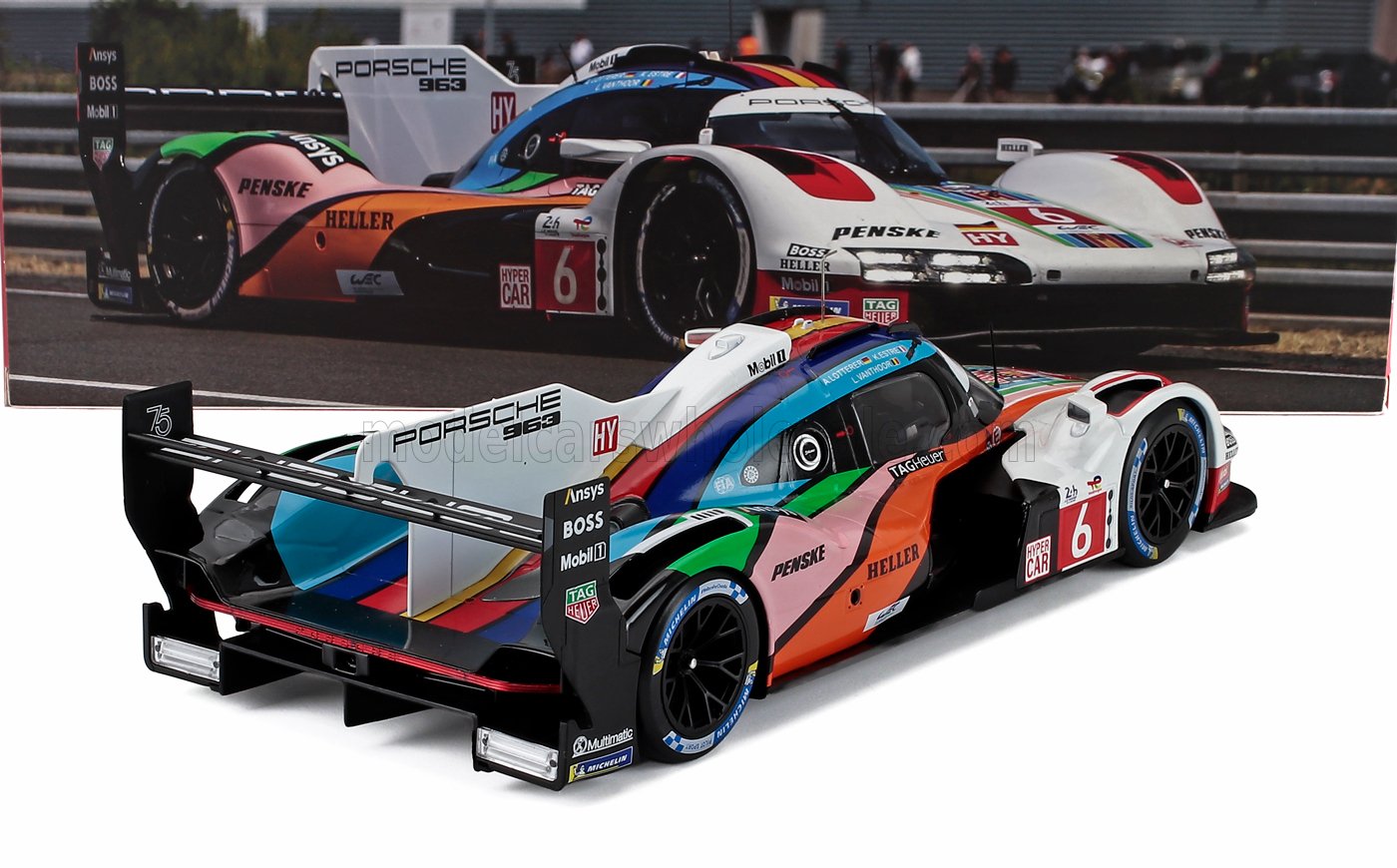 Porsche 963 scale model race car with vibrant livery, collectible now available online