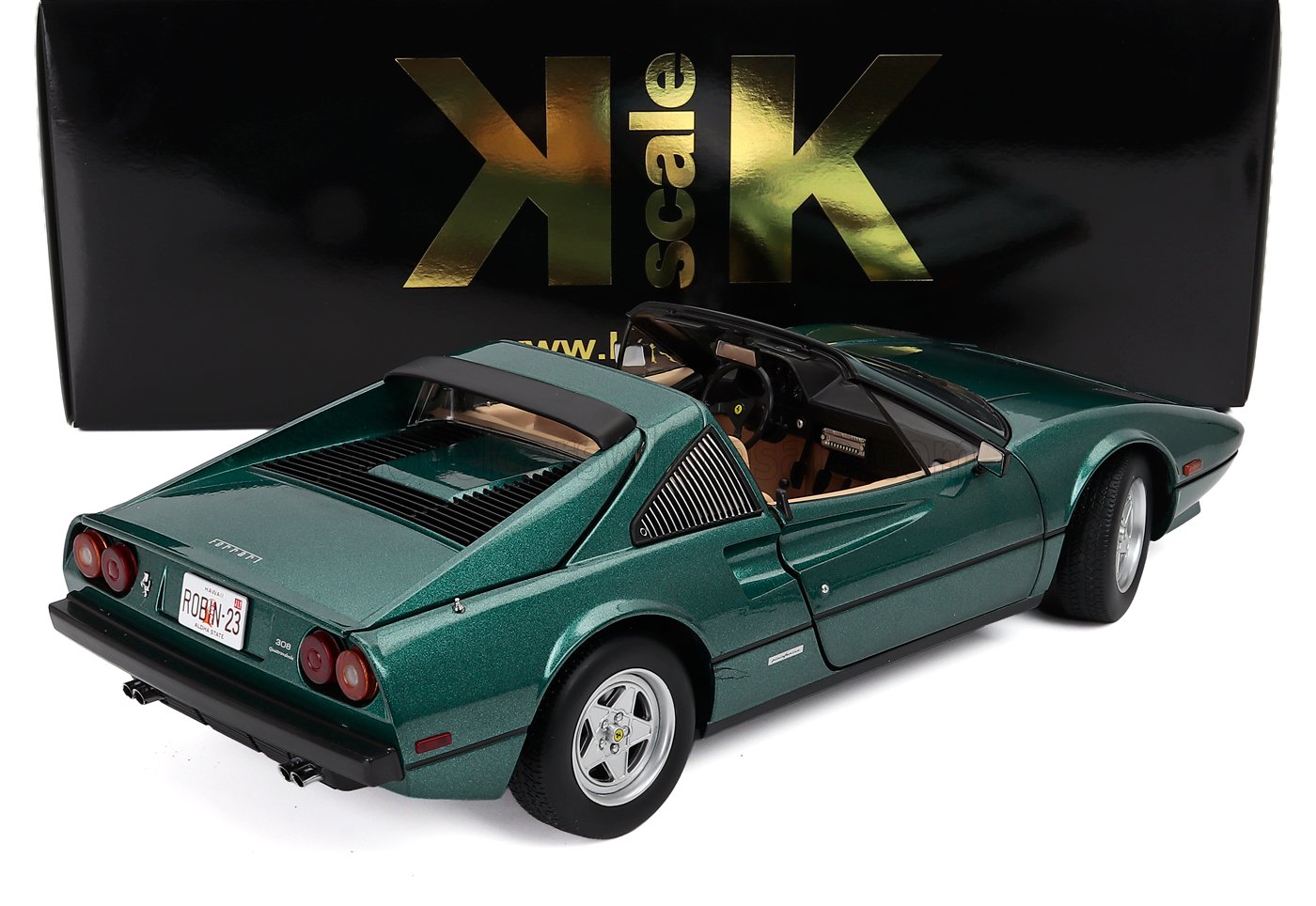 Modelo clásico de coche deportivo verde a escala 1:18 con techo abierto, interior detallado y vista trasera, actualmente disponible en Vroomi.