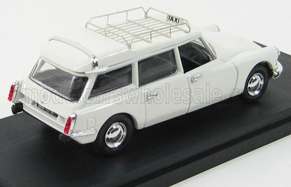 Modelo Citroën DS vintage blanco con señal de taxi y portaequipajes en el techo, presentado en la plataforma Vroomi.
