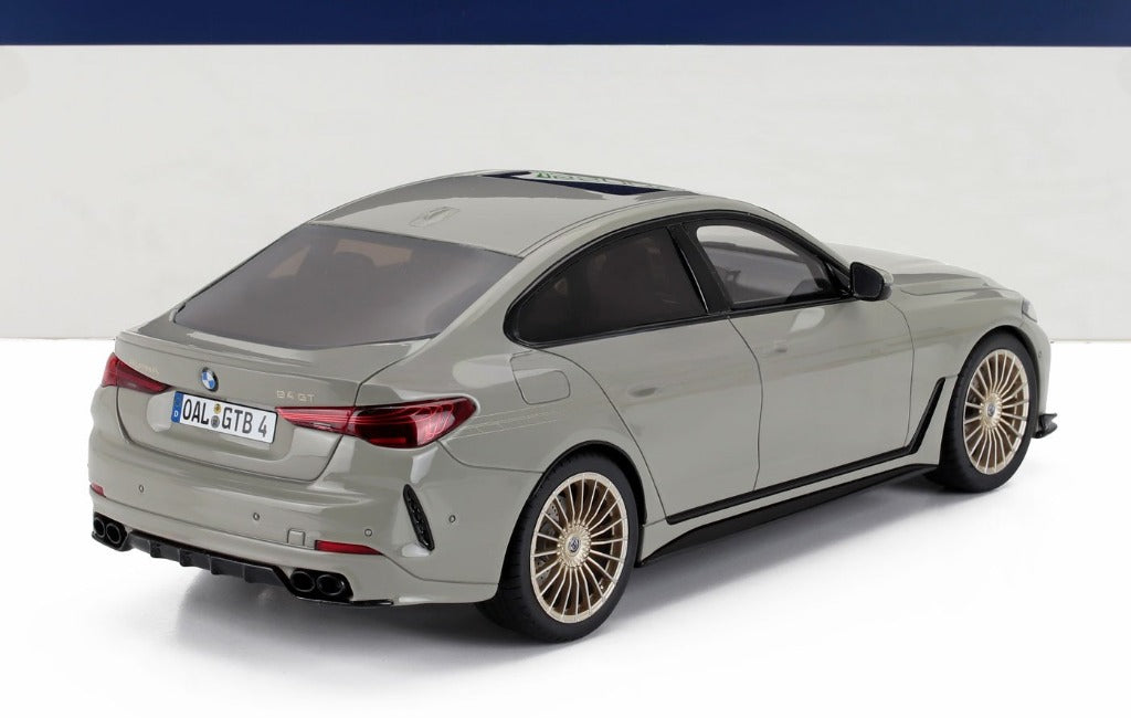 Gray BMW 6 Series GT with gold alloy wheels shown from rear side, now featured on Vroomi platform