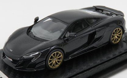 Modèle réduit de McLaren 650S noir avec jantes dorées sur socle d'exposition, disponible via la plateforme Vroomi.