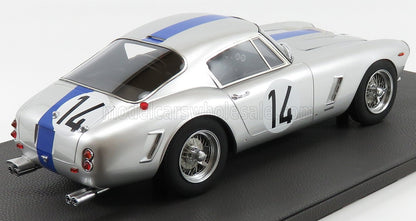 Modèle réduit de voiture de course classique argentée avec bande bleue et numéro 14, disponible via la plateforme Vroomi.