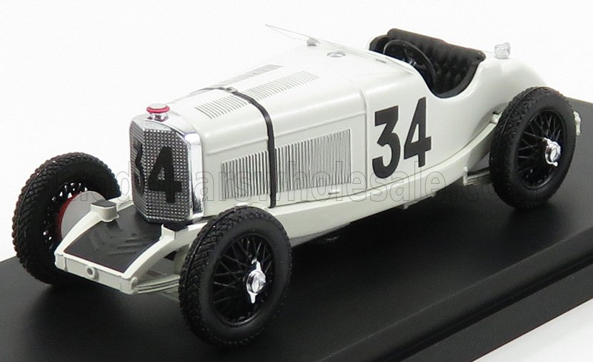 Modèle réduit de voiture de course vintage blanche numérotée 34 avec roues noires, disponible sur la plateforme Vroomi.