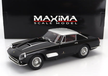 Black and silver Maxima scale model classic car with detailed wheels, showcased with branded box, available on Vroomi