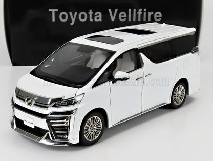 Modèle réduit de Toyota Vellfire blanche avec toit ouvrant, présenté sur un socle blanc, disponible à l'achat sur Vroomi.